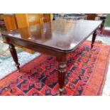 A VICTORIAN AND LATER MAHOGANY DINING TABLE WITH TWO LEAVES, THE RECTANGULAR ENDS ROUNDED ABOVE APR