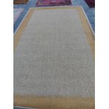 A CONTEMPORARY NATURAL FIBER WOVEN CARPET. 495 x 290cms