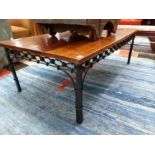 A LARGE HARDWOOD AND WROUGHT IRON COFFEE TABLE. H 47 X W 135 X D 77cms