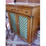 A REGENCY MAHOGANY SIDE CABINET WITH TWO DRAWERS ABOVE THE GRILLE FRONTED DOORS BETWEEN GUN BARREL