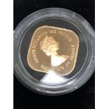 A 22ct GOLD PROOF BAILIWICK OF JERSEY QE2 ONE POUND COIN, IN A SEALED CAPSULE AND ROYAL MINT CASE.