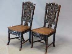 A PAIR OF CHINESE HARDWOOD SIDE CHAIRS, THE TOP RAILS PIERCED AND CARVED WITH SQUIRRELS AMONGST