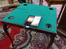 A MONOMARK BOMBAY-DE-LUXE FOLDING GAMES TABLE WITH FOUR DOORS IN THE BAIZE TOP OPENING ONTO