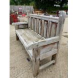 A LARGE WEATHERED HARD WOOD SETTLE WITH PANELED BACK W 183 x D 70 x H 107 cms