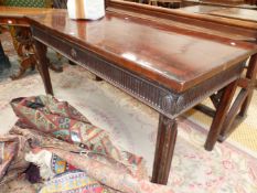 A GEORGIAN AND LATER CROSS BANDED MAHOGANY SERVING TABLE, THE RECTANGULAR TOP ABOVE A FLUTED APRON C