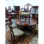 A SET OF SEVEN ANTIQUE MAHOGANY SHIELD BACK DINING CHAIRS, TO INCLUDE TWO ARM CHAIRS.