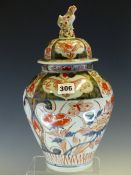 AN 18th C. JAPANESE IMARI JAR AND COVER, THE LATTER WITH A LION FINIAL, THE OVOID BODY PAINTED
