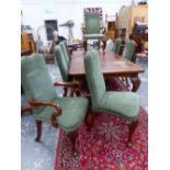 A SET OF EIGHT GEORGIAN STYLE MAHOGANY CHAIRS UPHOLSTERED IN GREEN VELVET, THE CABRIOLE FRONT LEGS
