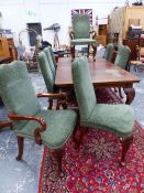 A SET OF EIGHT GEORGIAN STYLE MAHOGANY CHAIRS UPHOLSTERED IN GREEN VELVET, THE CABRIOLE FRONT LEGS