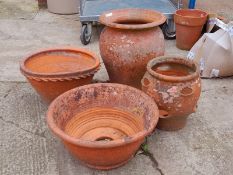 FOUR TERRACOTTA PLANTERS