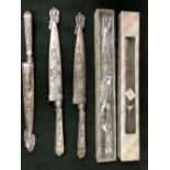 FOUR BOXED BRAZILIAN GAUCHO KNIVES AND SCABBARDS AND ANOTHER LOOSE, EACH MOULDED IN RELIEF WITH