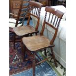 A PAIR OF UNUSUAL ELM SEAT COUNTRY SIDE CHAIRS WITH SPINDLE BACKS.