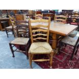 TWO SETS OF FOUR OAK AND ASH 18th CENTURY STYLE LADDER BACK SIDE CHAIRS.