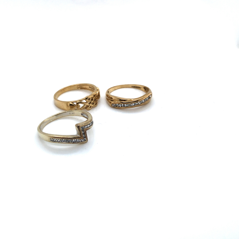 THREE 9ct HALLMARKED GOLD RINGS. TWO ETERNITY STYLE RINGS SET WITH CZ STONES AND THE OTHER A CELTIC