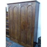 A 19th CENTURY OAK TWIN PANELLED TWO DOOR HANGING HALL CUPBOARD. H 170 X W 126 X D 45ms.