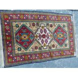 AN ORIENTAL RUG OF KAZAK DESIGN. 220 x 136cms