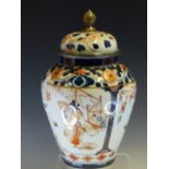 AN 18th C. JAPANESE IMARI JAR AND COVER, THE SHOULDERS AND LID WITH CHRYSANTHEMUMS IN LIGHT