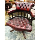 A BUTTON UPHOLSTERED LEATHER MAHOGANY DESK CHAIR, THE BACK AND ARMS SUPPORTED ON AN OPEN BALUSTRADE