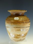 A THAI TEMMOKU GLAZED JAR WITH THE FLARED RIM ABOVE SCRATCH DECORATED BANDS ON THE SHOULDERS OF