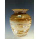 A THAI TEMMOKU GLAZED JAR WITH THE FLARED RIM ABOVE SCRATCH DECORATED BANDS ON THE SHOULDERS OF