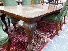 A LATE VICTORIAN MAHOGANY RECTANGULAR DINING TABLE ON FOUR CABRIOLE LEGS WITH BALL AND CLAW FEET AND