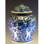 A CHINESE BLUE AND WHITE BALUSTER JAR AND COVER PAINTED WITH PHOENIX FLYING AMONGST FLOWERING VINES.