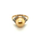 A HALLMARKED 9ct GOLD GOLDEN SOUTH SEA PEARL AND WHITE ZIRCON DRESS RING. PEARL APPROX 9mm. FINGER