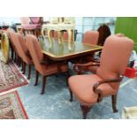 A SET OF SIXTEEN GEORGIAN STYLE MAHOGANY ELBOW CHAIRS UPHOLSTERED IN DIAMOND PATTERNED TERRACOTTA