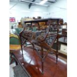 A CHIPPENDALE STYLE MAHOGANY BOOK RACK SIDE TABLE