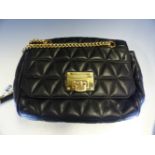 A MICHAEL KORS QUILTED BLACK LEATHER CROSS BODY BAG. W 28 cm