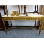 AN ANTIQUE CONTINENTAL CARVED GILT WOOD THREE DRAWER SIDE / DRESSING TABLE. H 77 X W 134 X D 63cms.