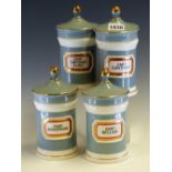 GLADSTONE POTTERY MUSEUM FOR CHALSYN Ltd., FOUR GREY CYLINDRICAL PHARMACY JARS AND COVERS