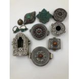 SEVEN VARIOUS TIBETAN AMULETS, MAINLY IN WHITE METAL, SOME SET WITH CORAL OR TURQUOISE, A PAIR OF