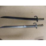 A FRENCH MODEL 1866 SABRE OR CHASSEPOT BAYONET DATED 1869, TOGETHER WITH ANOTHER SIMILAR UNMARKED