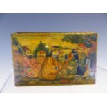 A PERSIAN PAPIER MACHE SNUFF BOX, THE RECTANGULAR LID PAINTED WITH TWO MEN AND A LADY SEATED IN A