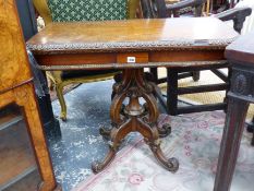 A VICTORIAN BURR OAK FOLD OVER CARD TABLE ON CARVED QUADRUPED SUPPORTS. H 74 X W 92 X D 92cms OPEN.