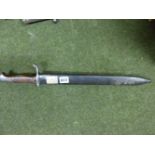 A GERMAN MODEL 1898/05 FIRST PATTERN BAYONET, BY HAENEL OF SUHL AND DATED 1915, CONTAINED IN ITS