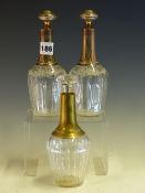 A PAIR OF FRENCH FLORAL ENGRAVED CLEAR GLASS BOTTLES AND STOPPERS WITH SILVER MOUNTED NECKS,