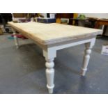 A PINE TABLE ON GREY PAINTED BALL TOPPED CYLINDRICAL LEGS TAPERING TO SPINDLE FEET. W 213 x D 91 x H