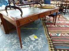 A LARGE REGENCY STYLE WRITING TABLE WITH THREE FRIEZE DRAWERS AND LEATHER INSET TOP
