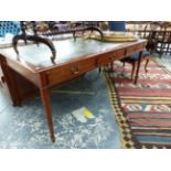 A LARGE REGENCY STYLE WRITING TABLE WITH THREE FRIEZE DRAWERS AND LEATHER INSET TOP