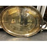 AN ELECTROPLATE TWO HANDLED OVAL TRAY WITH THE DATE 1880 BELOW THE CENTRAL CREST AND MOTTO