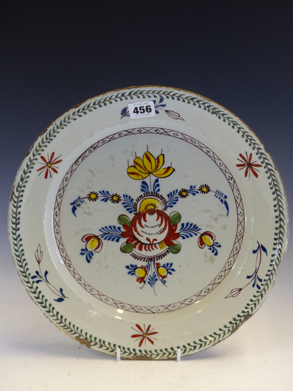 A PAIR OF MID 18th C. ENGLISH POLYCHROME DELFT DISHES PAINTED WITH CENTRAL SPRAYS OF FLOWERS