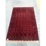 A TEKKE BOKHARA SMALL CARPET. 290 x 187cms