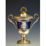 A FRENCH SILVER TWO HANDLED CUP, COVER AND BLUE GLASS LINER, DISCHARGE MARKS, THE RIM WITH EGG AND