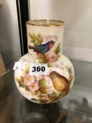 A MID VICTORIAN ROYAL WORCESTER VASE PAINTED WITH TWO BIRDS AMONGST SPRING FLOWERS