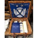 AN OPTIMA PICNIC BASKET WITH FITTINGS