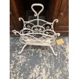 A WROUGHT IRON TWO COMPARTMENT CANTERBURY