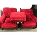 A PAIR OF LARGE OAK EASY ARMCHAIRS, TOGETHER WITH A SIMILAR FOOT STOOL, ALL COVER IN FLORAL RED