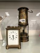 A THOMAS & WILLIAMS MINERS LAMP TOGETHER WITH A CARRIAGE TIMEPIECE